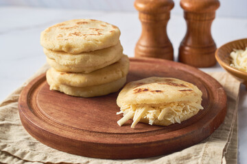 Arepa made from ground corn dough, cornmeal, traditional in the cuisine of Colombia and Venezuela...