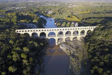 Papier Peint photo Pont du Gard The "Pont du Gard" is an ancient Roman aqueduct bridge built in the first century AD to carry water (31 mi) .It was added to UNESCO's list of World Heritage  Sites in 1985