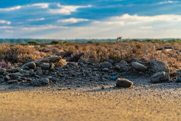 Stony rocks and sands with clouds all over.