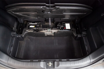 Open empty trunk of a kei car close-up after washing and vacuuming  ready for loading luggage with...