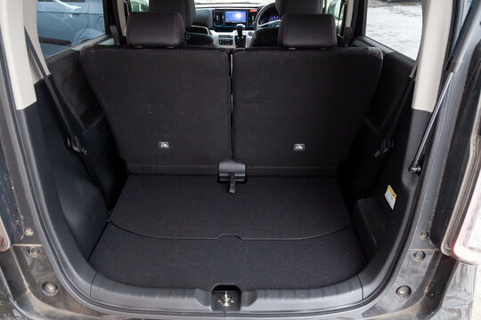 View of the interior of a Honda N-WGN kei car class with a trunk luggage compatment