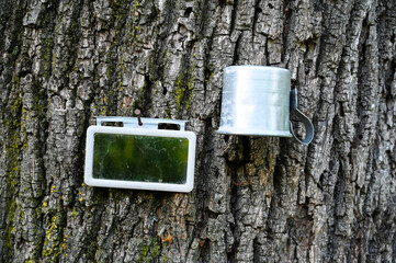 Mirror and glass on wood. Shaving accessories in the countryside.