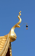 Fototapeta na wymiar Thailand temple roof with blue sky