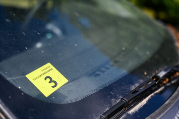 Emissions sticker on car windshield.  Eco sticker. 