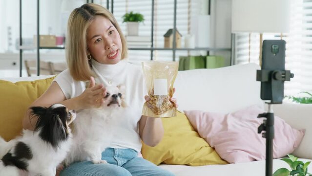 Influencer youtuber adult asia woman people blogger live talk chat review dog food pet lover on IG reel instagram tiktok shop. Vlogger happy side hustle fun reviewer blog vlog page on social media app