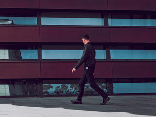 man in black clothes, city walk