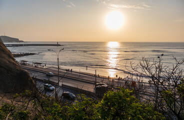 Panoramic view of Barranco beach in Lima from a hill in an emotional sunset.