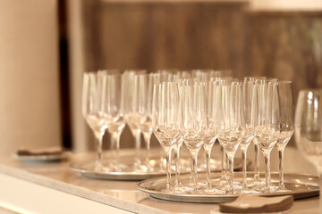 champagne crystal glasses on tray ready to serve