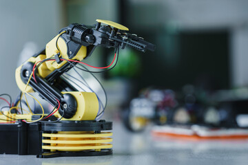 Robot arm and robotic cars project, using computers and coding. technology of robotics programing...