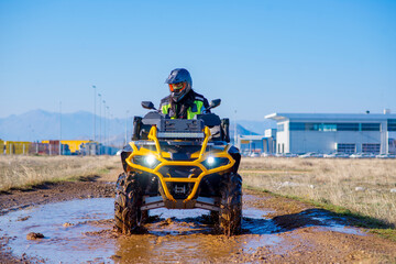 Girl driving ATV on dirt road © Addy