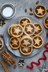 Traditional christmas  fruit mince pies on a plate. Shortcrust pastry pies stuffed with raisins, nuts, apples. Top view © Olga Romankova