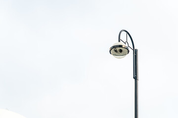 Light post with white sky background and multi light, copy space