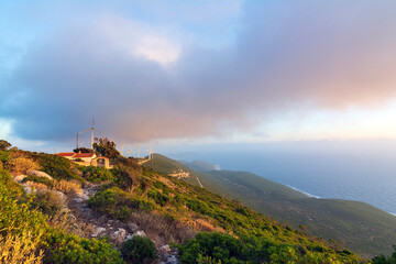 Fototapeta na wymiar Sunset at St. Nicholas church on the mountain near Pylos in Messinia, Greece