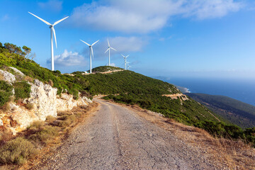 Fototapeta na wymiar Wind turbines in the mountains near the sea