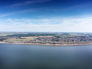 birds eye view above the sea looking at the coastline of england