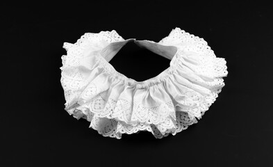 vintage white collar with ruffles on black background - obrazy, fototapety, plakaty