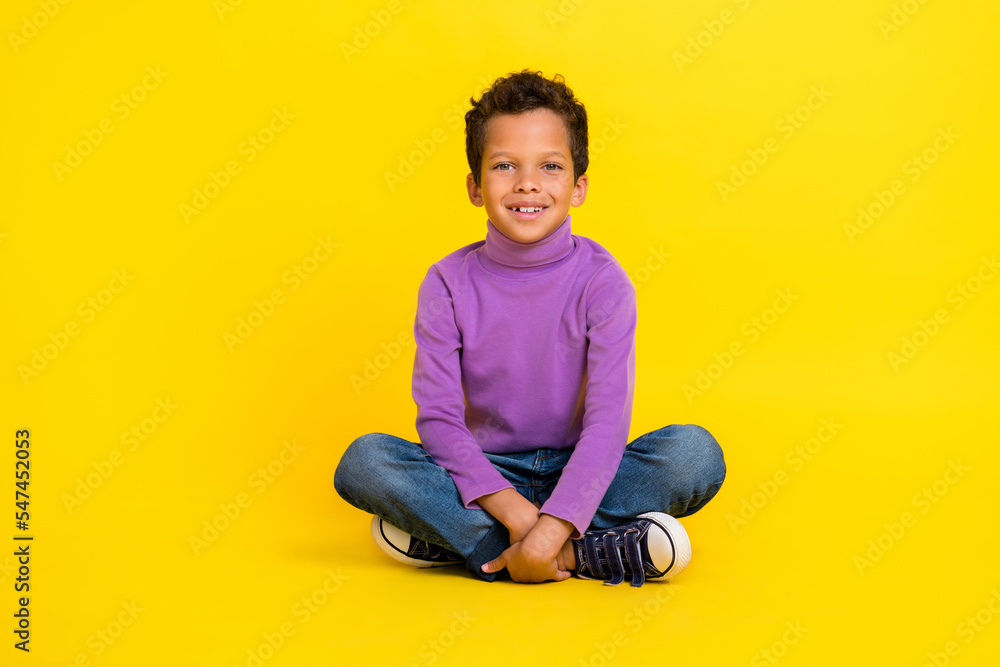 Sticker full size photo of cheerful positive boy sit floor toothy smile good mood isolated on yellow color b