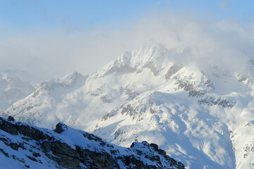 Panorama of the winter high mountains in Switzerland Alps.
