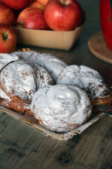 Spanish sweet bread spiral-shaped and sprinkled with powdered sugar. Perfect for breakfast. Rustic style.