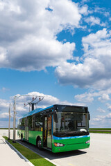 Fototapeta na wymiar Electric bus with charging station. Concept 
