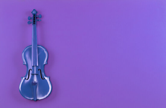 blue violin on purple background