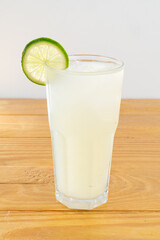 cocktail glass, on wood table