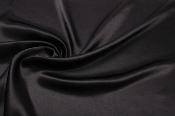 Black nacre wave fabric silk. Abstract texture horizontal copy space background.