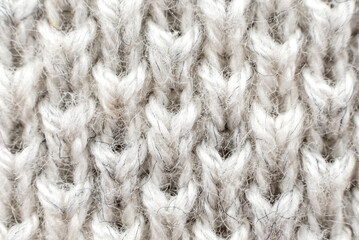 White natural texture of knitted wool textile material background. White crochet cotton fabric woven canvas texture. close up