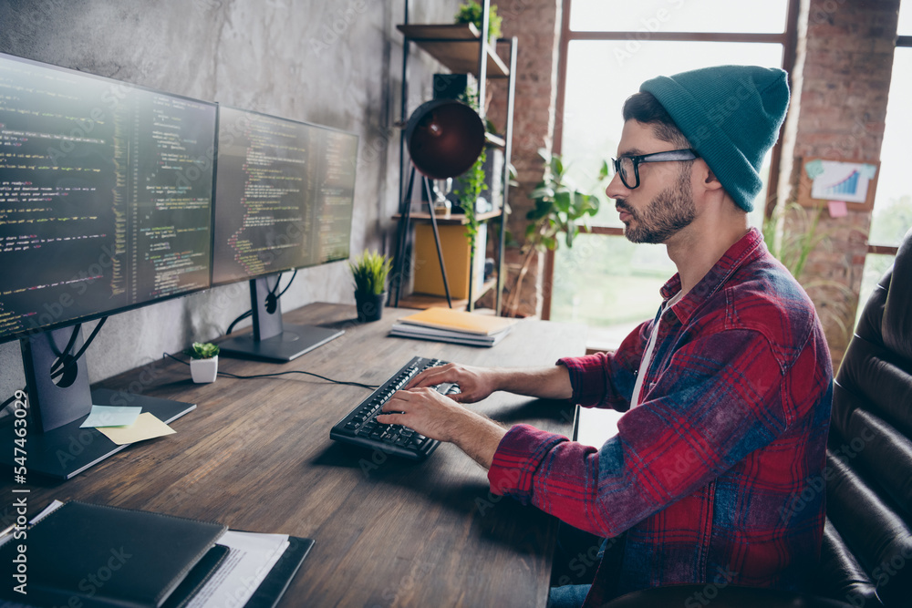 Poster photo of cool intelligent programmer wear spectacles typing front end code modern device indoors wor