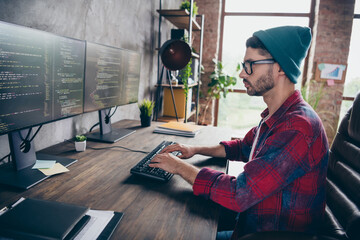 Photo of cool intelligent programmer wear spectacles typing front end code modern device indoors...