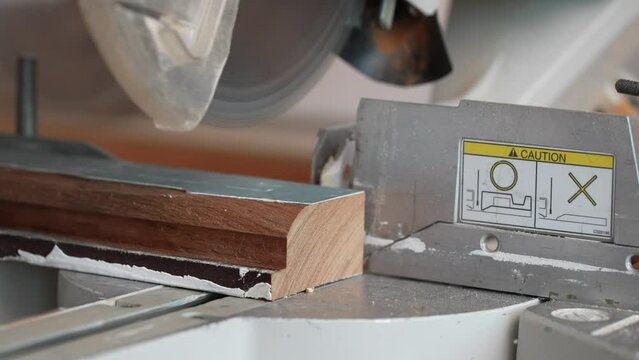 Slow Motion mitre saw cutting wood