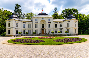 Fototapeta na wymiar Historic rococo and neoclassical Myslewicki Palace in Royal Baths Lazienki Krolewskie park in Ujazdow district of Warsaw in Poland