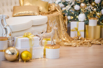 Fototapeta na wymiar Beautiful New Year gift boxes with satin ribbon bow under Christmas tree.