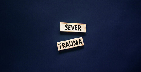 Sever trauma symbol. Concept words Sever trauma on wooden blocks. Beautiful black table black...