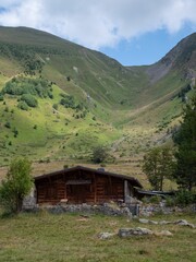 Landscape of a chalet on fields under green mountains in Haute Savoie in France