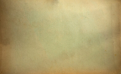 Photo of the texture of an old cardboard sheet. Yellowed cardboard background for text.