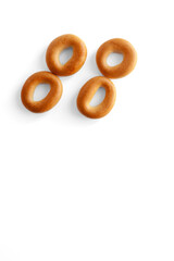 Symbol double quote bagel. Bagels font. Alphabet from set of small dry bagels isolated on white background. ABC symbols.