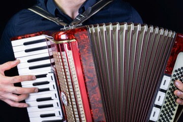 Man playing accordion with fingers - obrazy, fototapety, plakaty