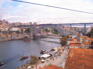 Porto, Portugal: November 13 2022. Aerial view of Porto and Dom Luis I Bridge and Douro river from Teleferico de Gaia, a cable car in Vila Nova de Gaia