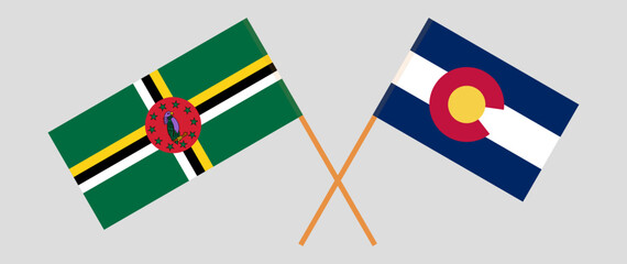 Crossed flags of Dominica and The State of Colorado. Official colors. Correct proportion