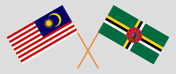 Crossed flags of Malaysia and Dominica. Official colors. Correct proportion