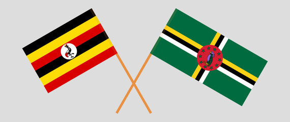 Crossed flags of Uganda and Dominica. Official colors. Correct proportion