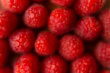 Raspberry close-up on a beautiful stand, summer fruit. Fruits are good for health. Proper nutrition, raw food.