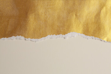 Torn pieces of paper texture copy space background. Beige  and gold color.
