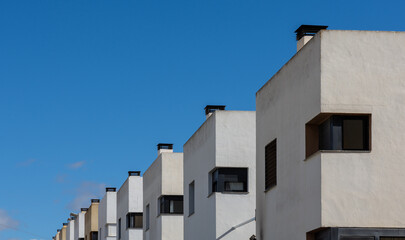 Row of houses in perspective with sky