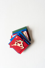 wooden reindeer and paper tiles on blank paper