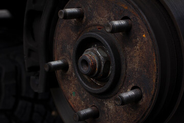 Car brake discs and rusted brake bolts. Restoration of brake discs. Tire maintenance