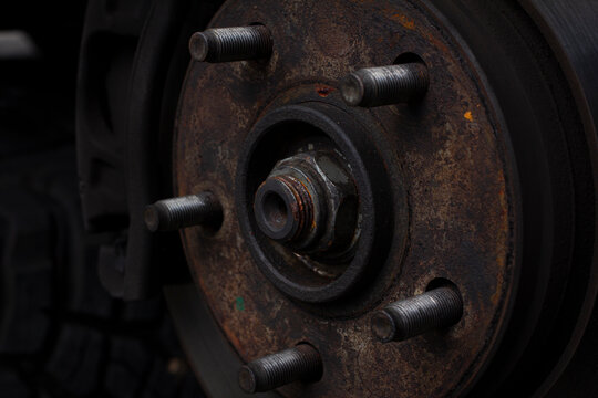 Car Brake Discs And Rusted Brake Bolts. Restoration Of Brake Discs. Tire Maintenance