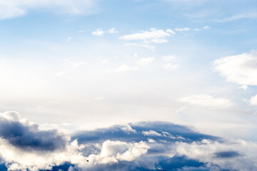 Obraz premium A beautiful blue autumn sky with white fluffy clouds makes for a fabulous overall view of the sky