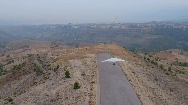 a microlite taking off at the airport